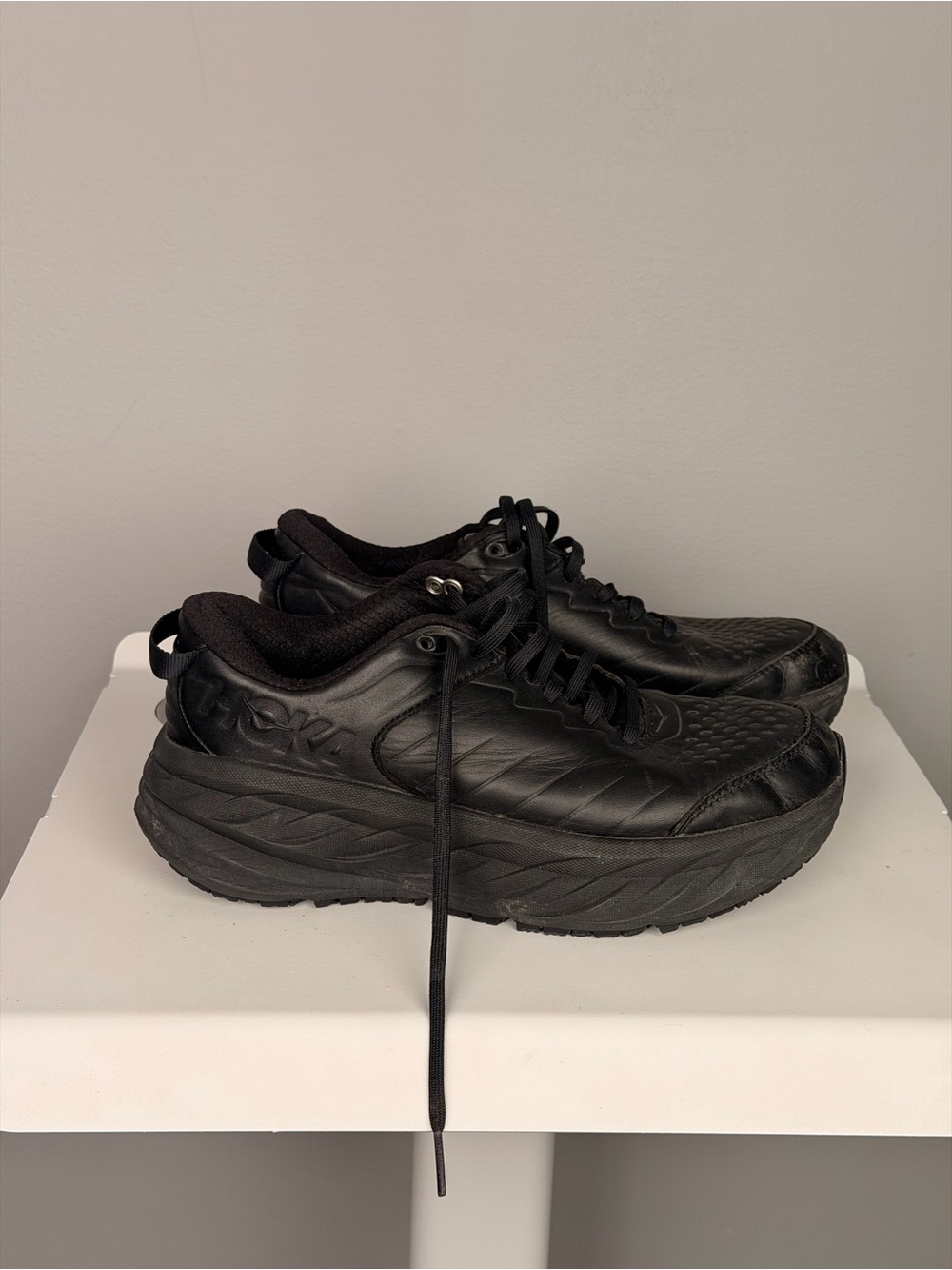 the HOKA Bondi SR in the "Triple Black" colorway.